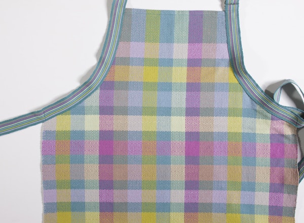 Peter’s Apron, designed by Rebecca Fox, is fastened with an inkle band. Photo by Joe Coca