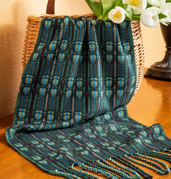 Shelby Moravec’s Flight of Dragonflies Scarf uses 20/2 silk in warp and weft.