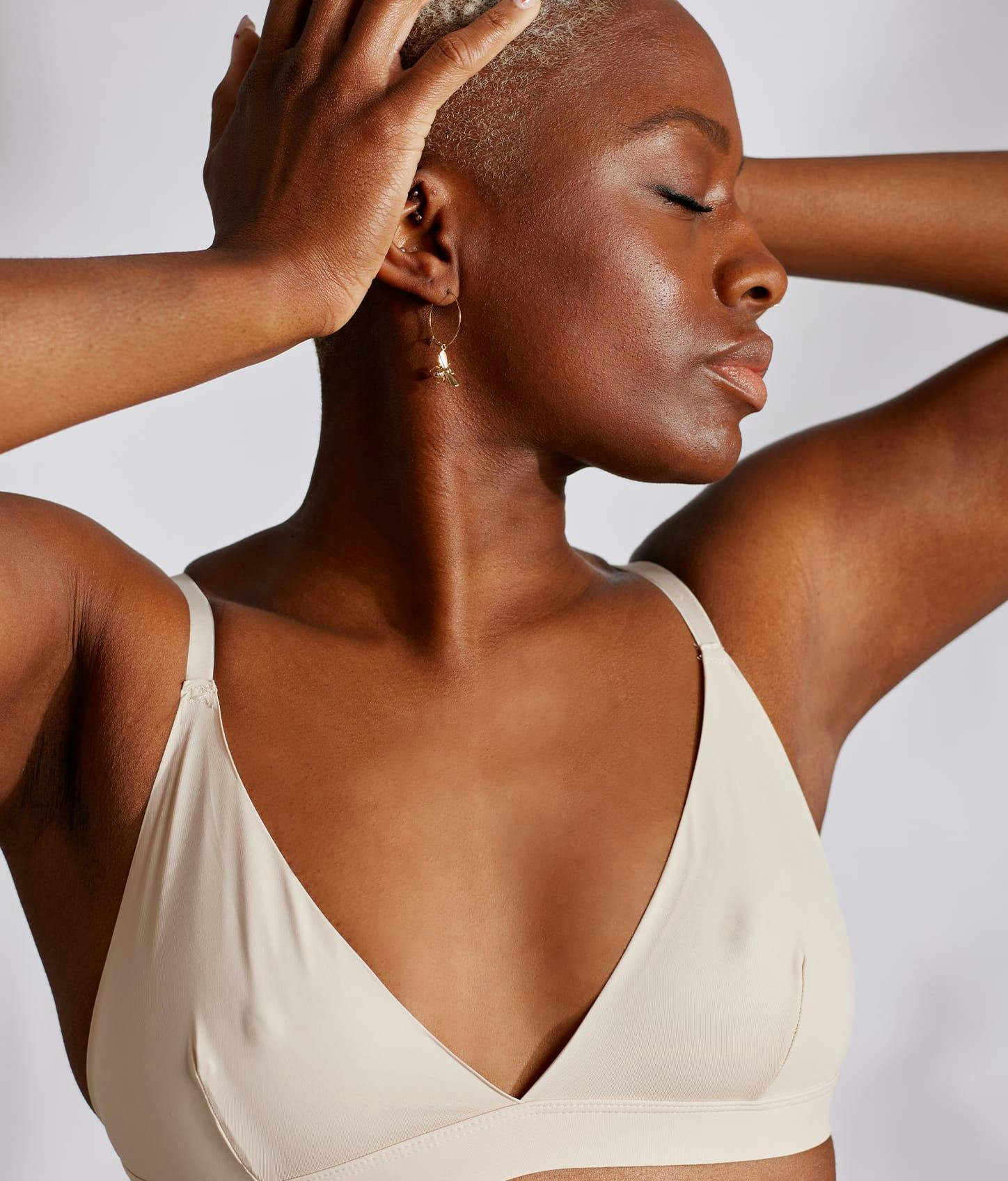 woman in white bra with smaller breasts.