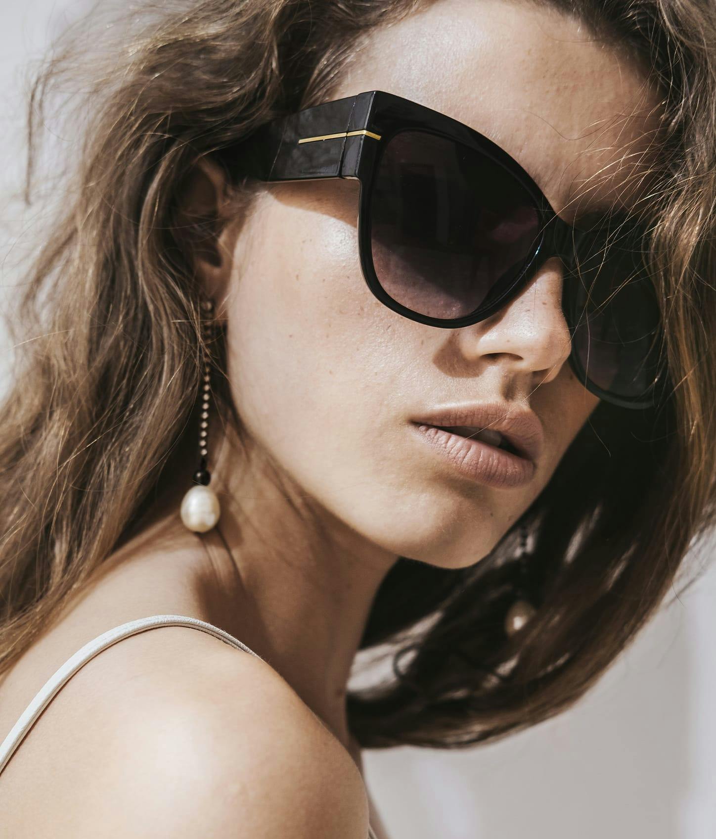 close up of woman in sunglasses