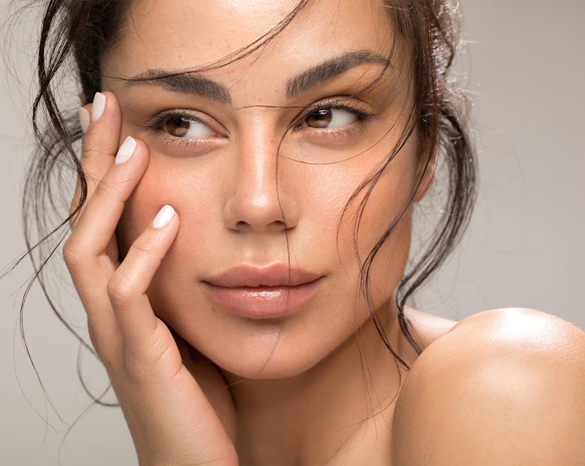 close up of woman with messy hair looking to her right
