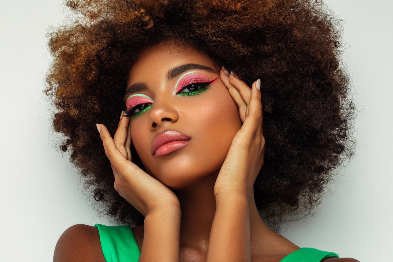 Close up of gorgeous women with colorful eye shadow.