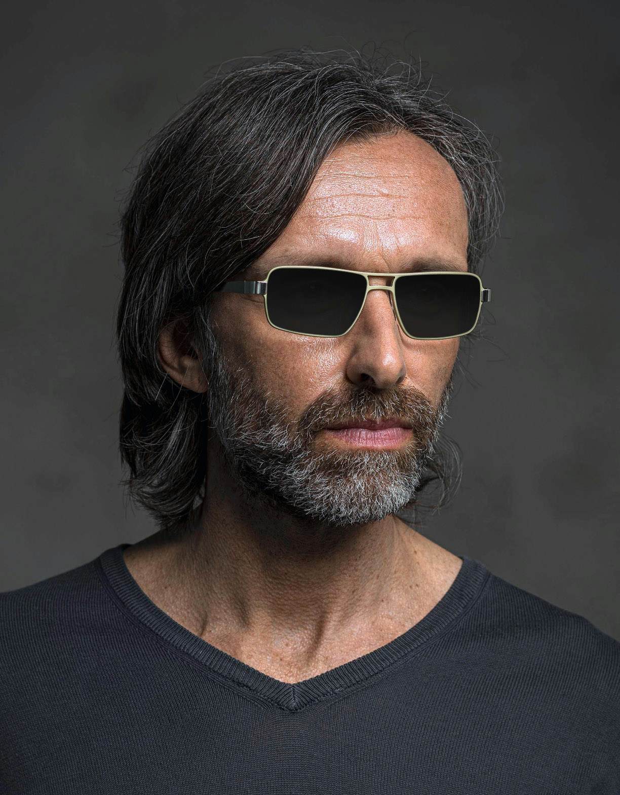 The model is wearing 850 Champagne glasses with smoke lenses featuring a magnifying insert for presbyopia