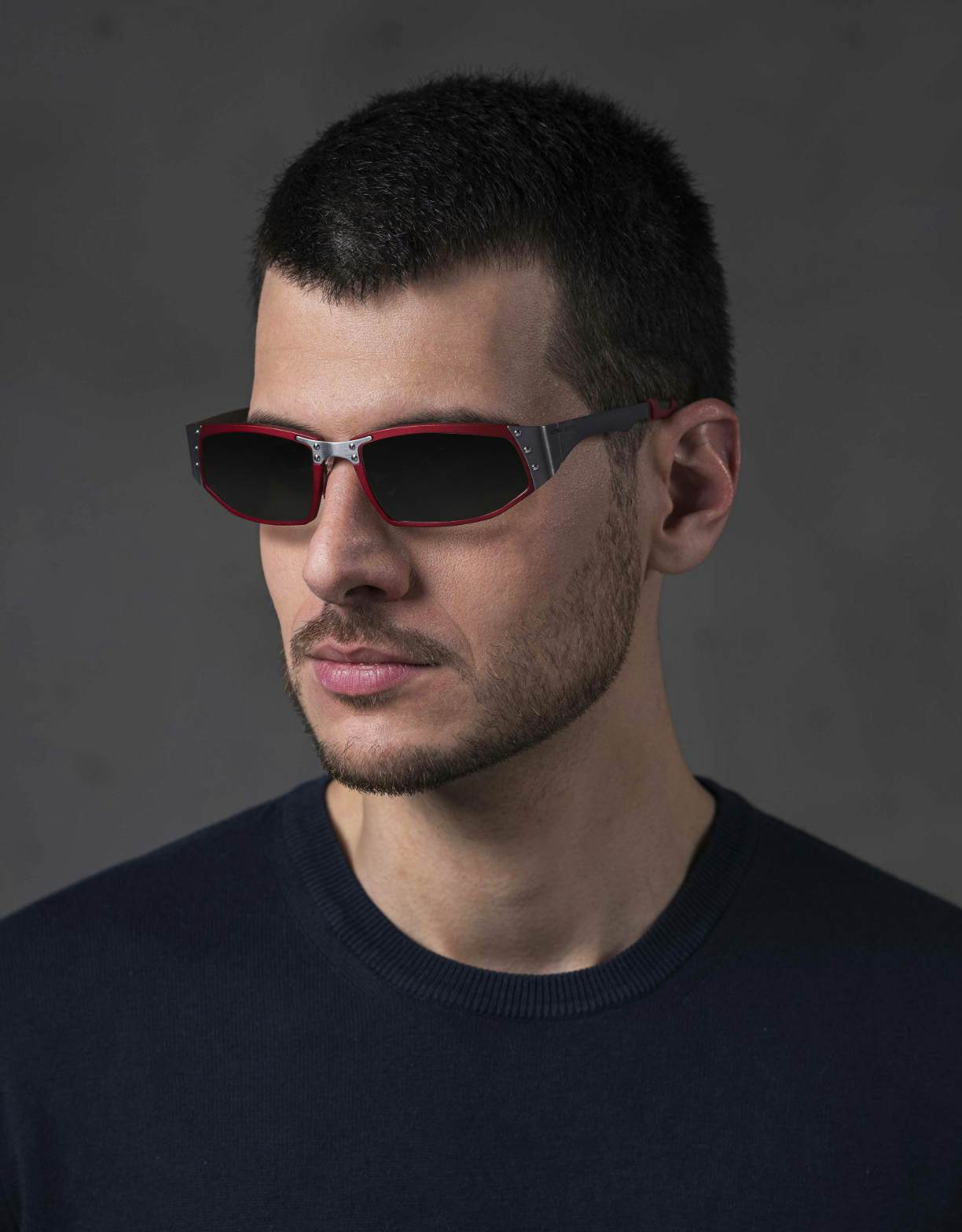 The model is wearing Touring 960 Red glasses with smoke lenses featuring a magnifying insert for presbyopia