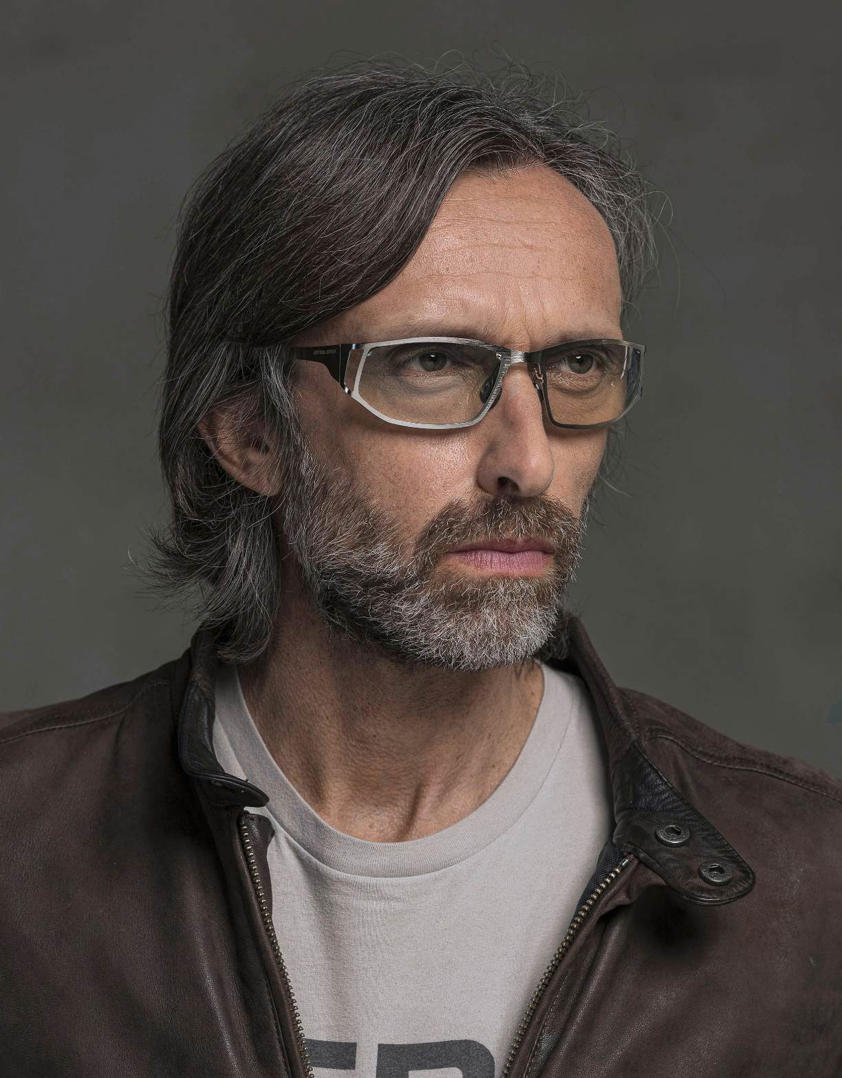 The model is wearing Dynamic Palladium glasses with vision lenses
