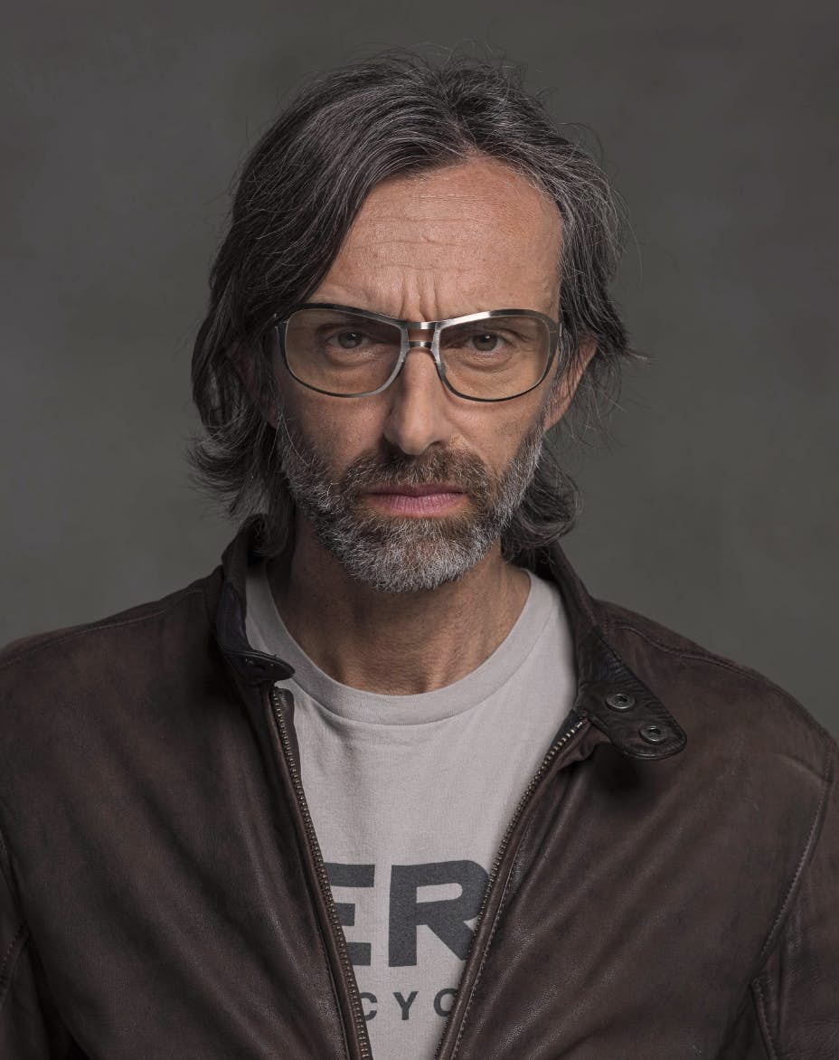 The model is wearing Special Palladium glasses with amber lenses