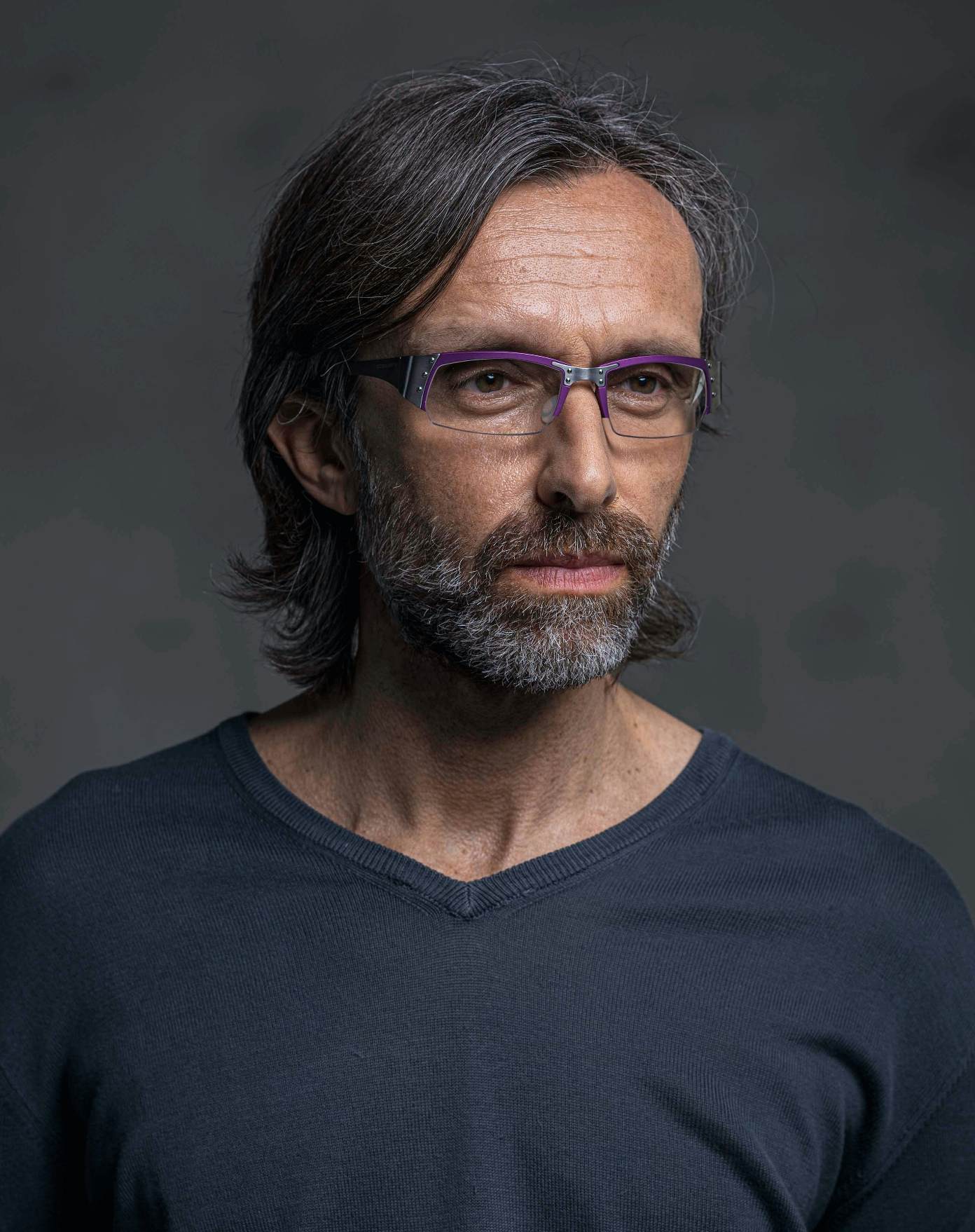 The model is wearing Touring 930 violet glasses with vision lenses