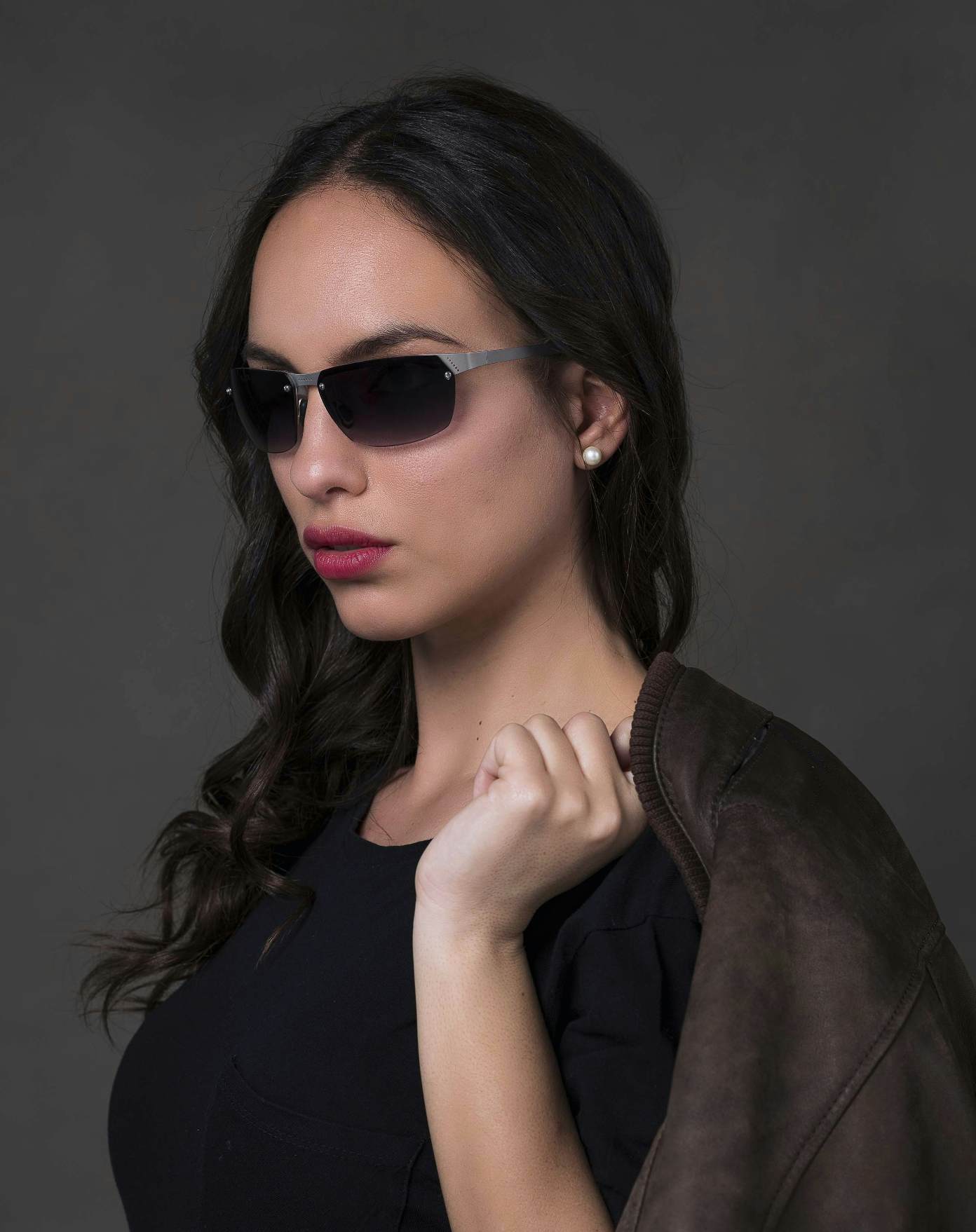 The model is wearing Aero Play Palladium with smoke lenses