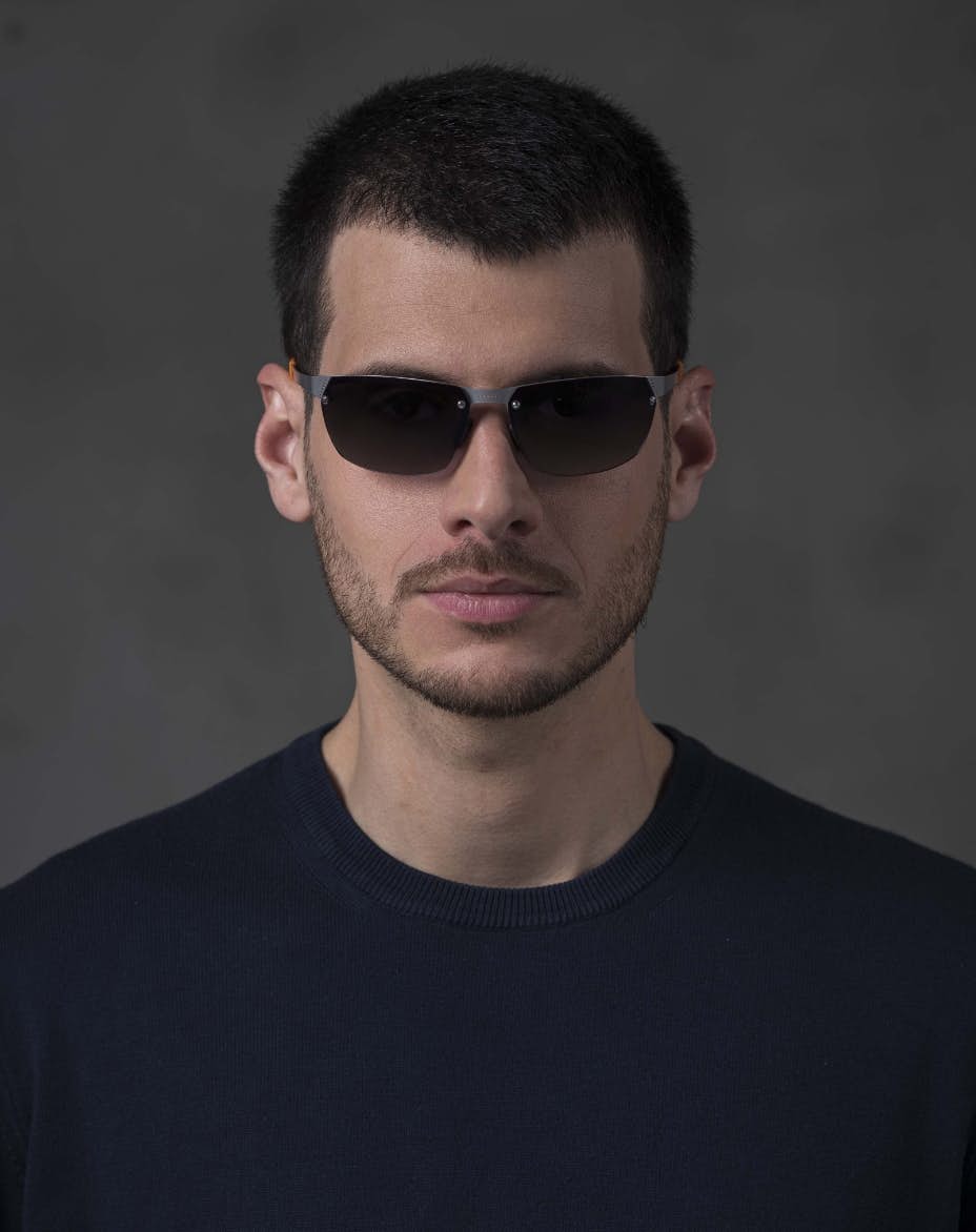 The model is wearing Aero Play Palladium with smoke lenses