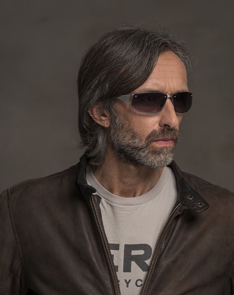 The model is wearing A Cosmic Palladium glasses with gradient lenses