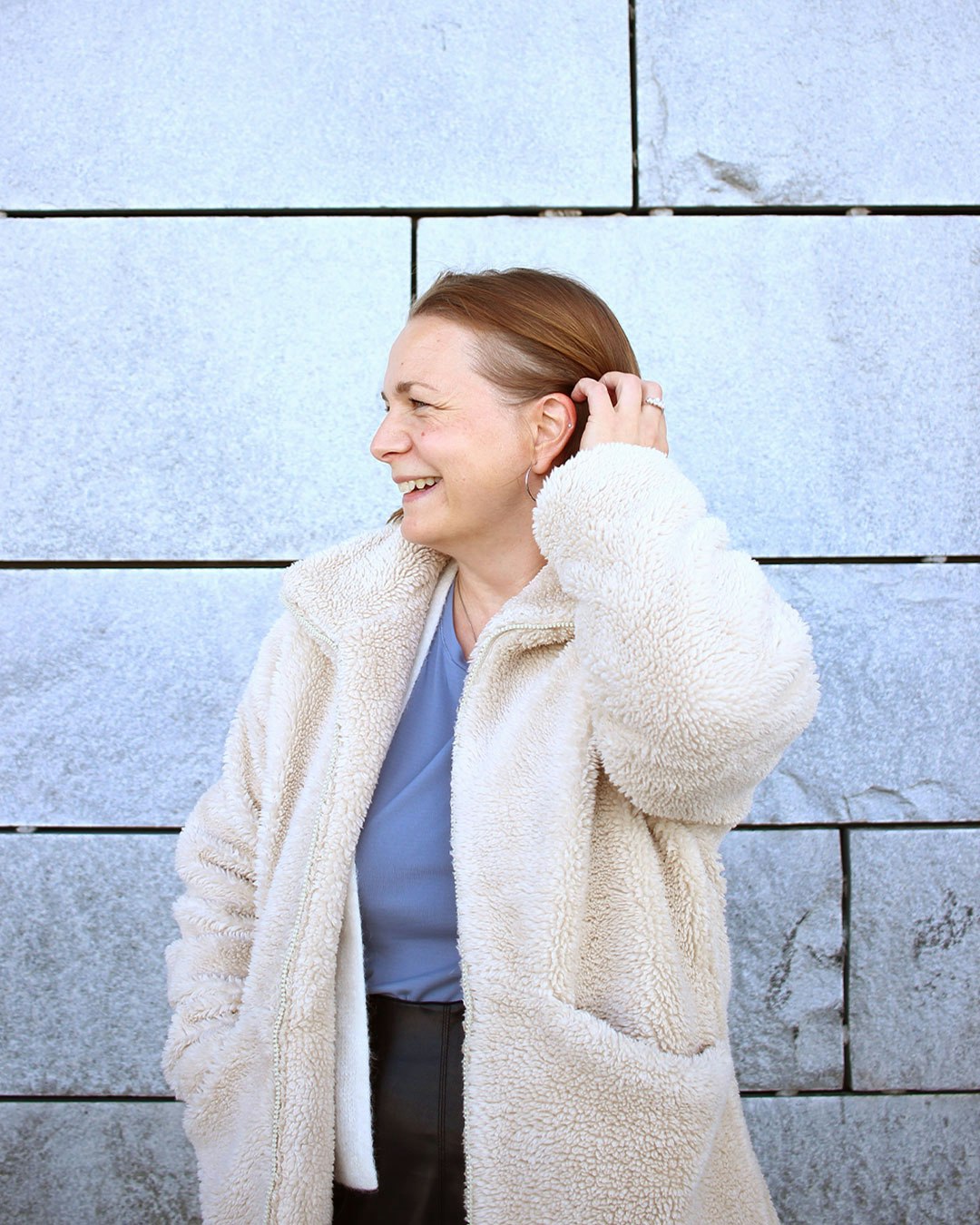 Malin wearing a white jacket