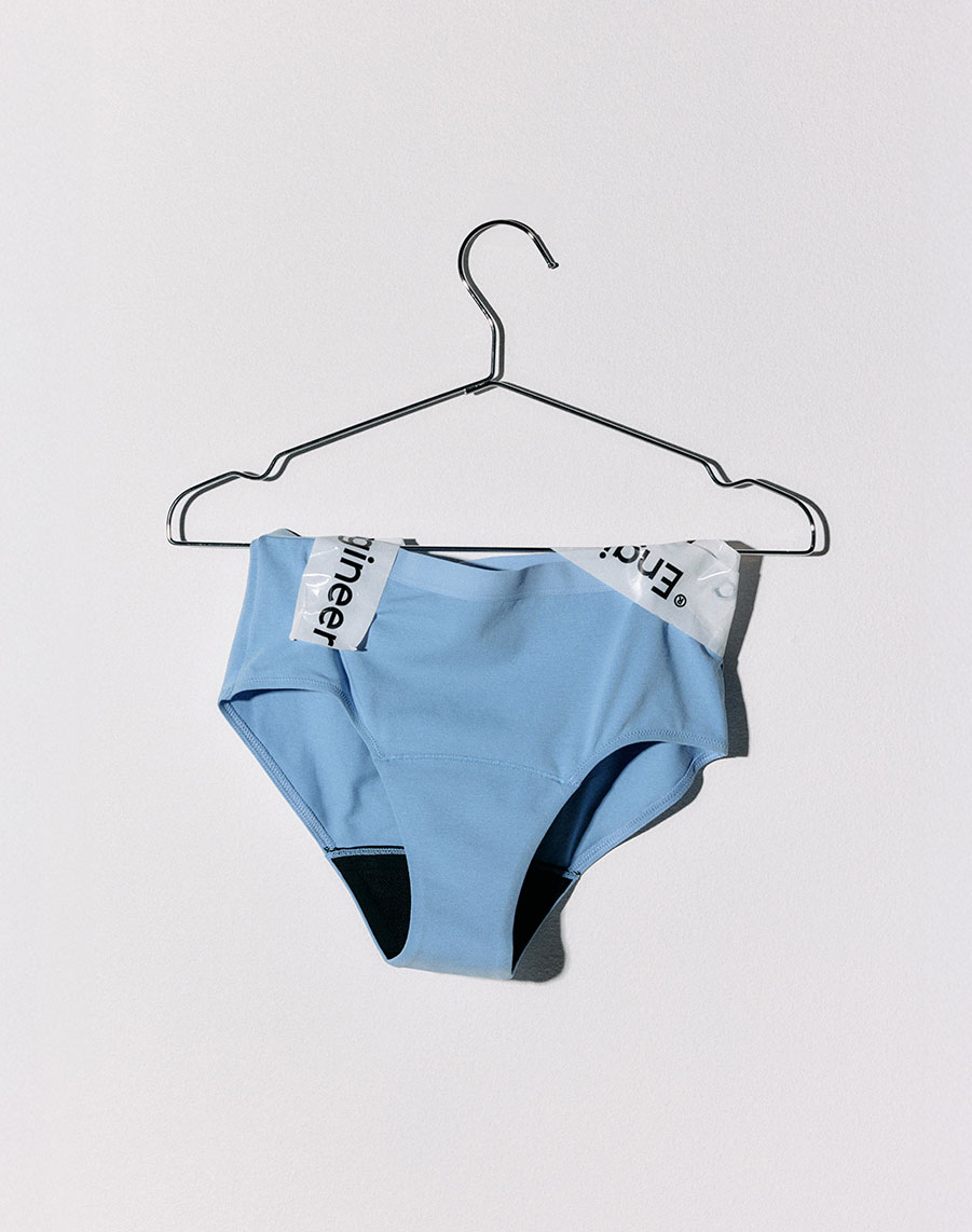 Light blue period panties on a hanger.