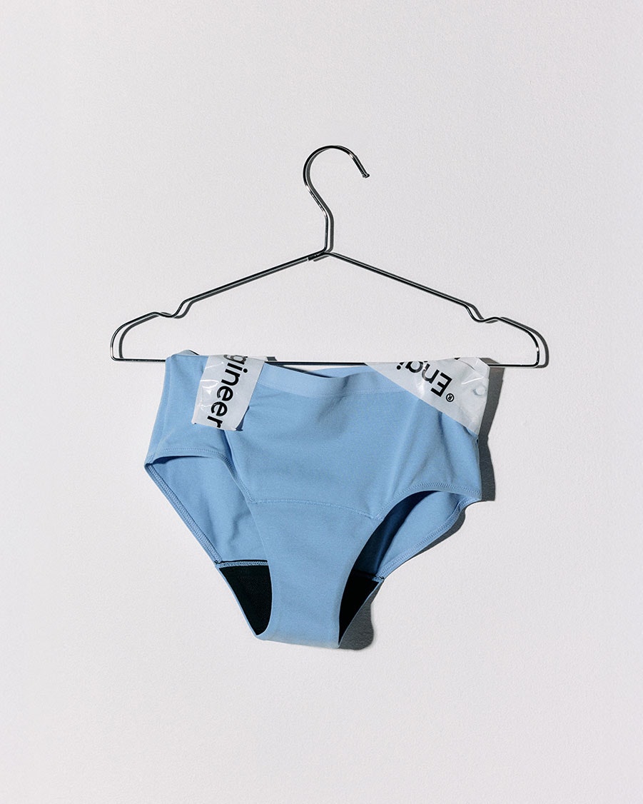Light blue period panties on a hanger.