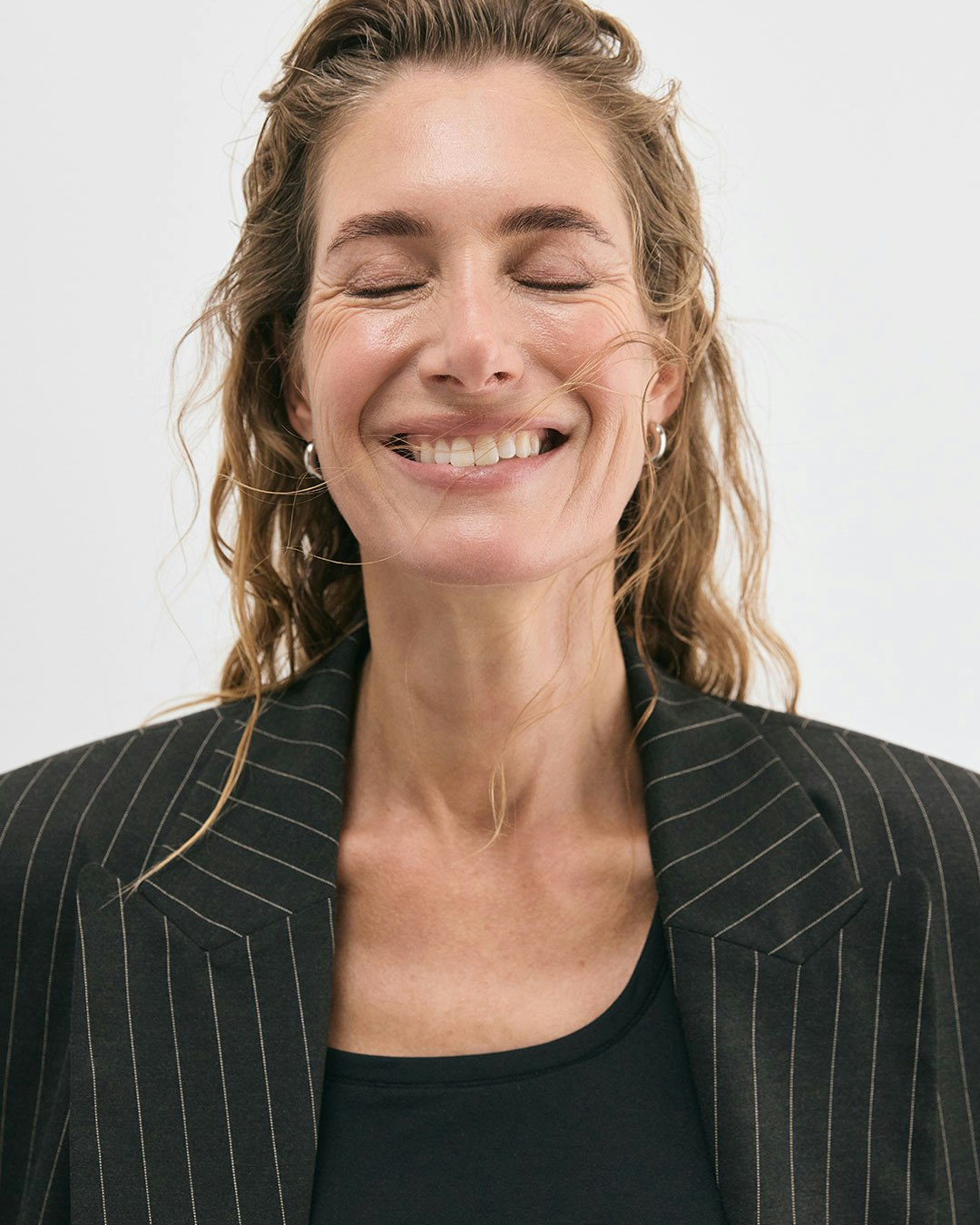 Close-up image on a woman with a big smile