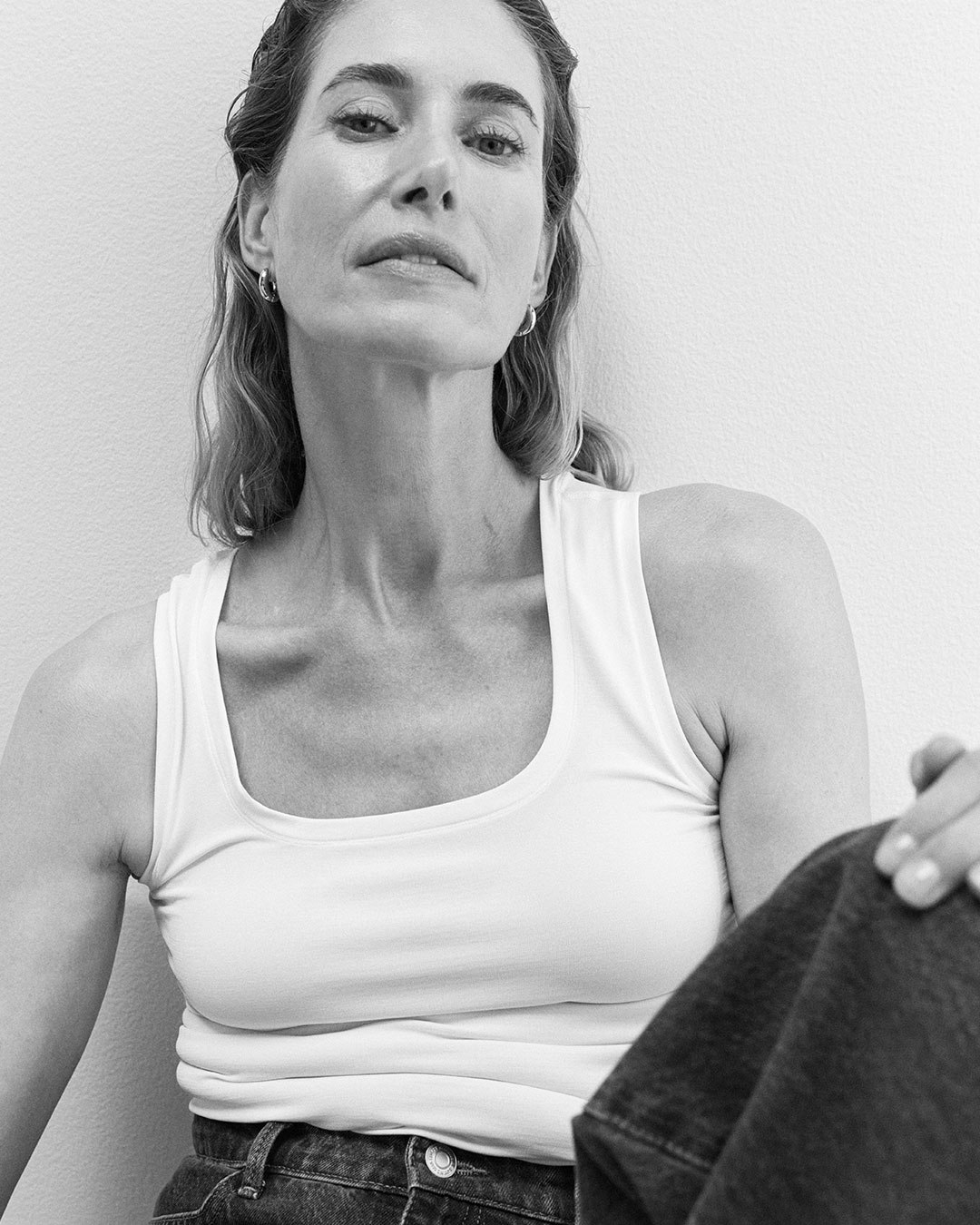 Woman in a white menopause tank top