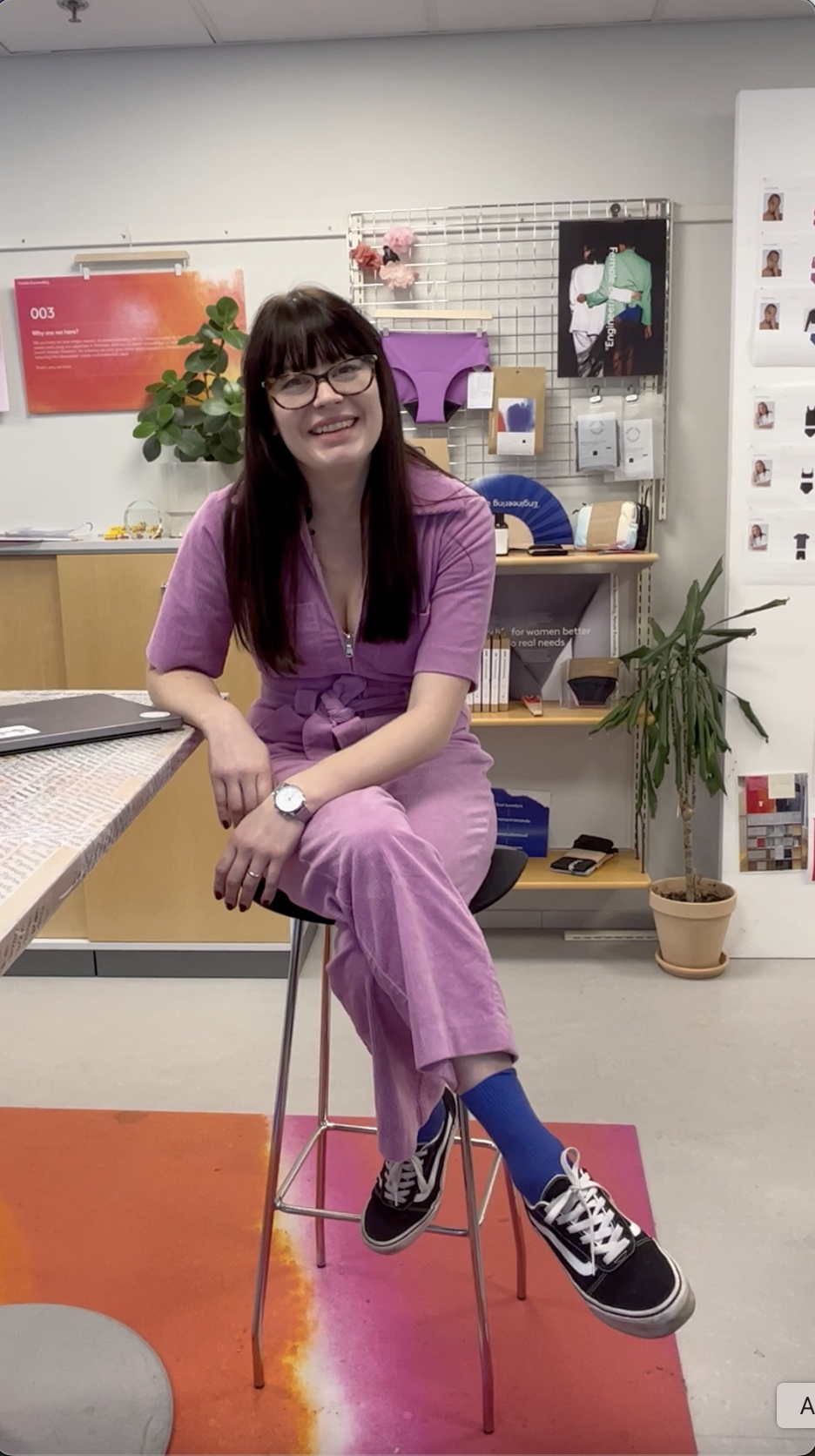 Moa sitting in a chair smiling