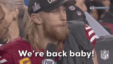 animated GIF of football player in gear during an interview shouting "Woo. We're back baby"