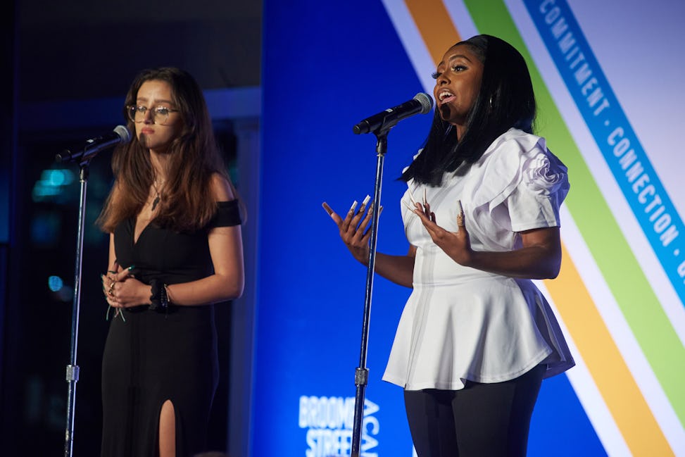 Door youth performers Amanda and Orissa singing Elton John’s “Love Song”