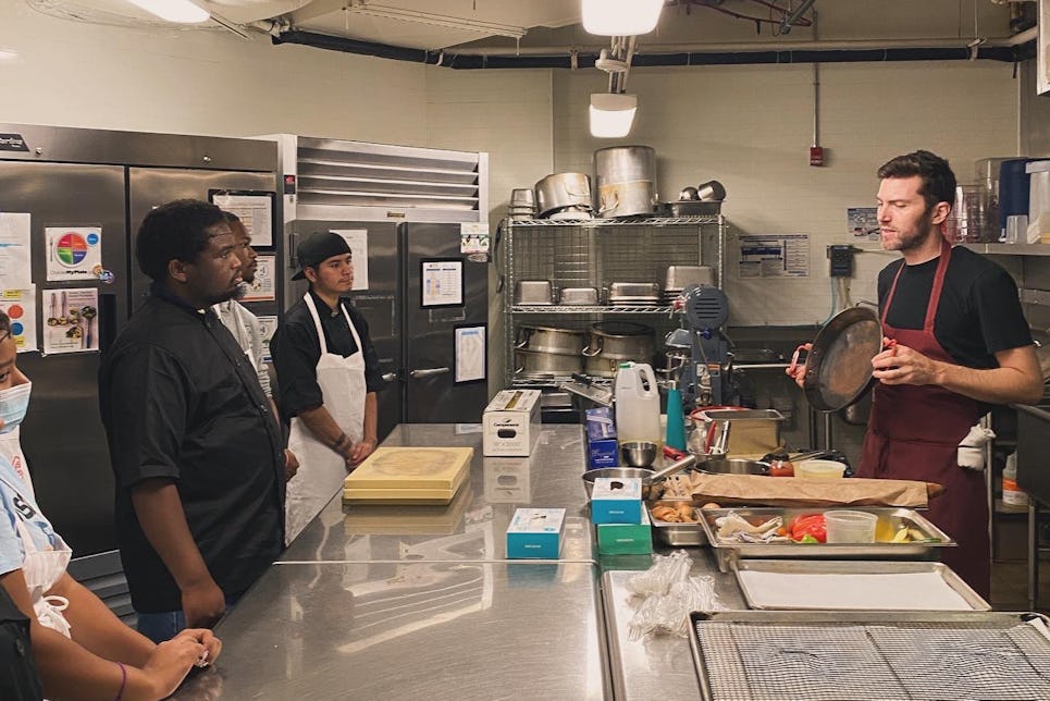 Chef Jonah Miller ( @senorhuertas ) leading a cooking demo led in our kitchen with our current culinary training cohort. Our chefs learned to make tortilla espagnol and panne con tomate.