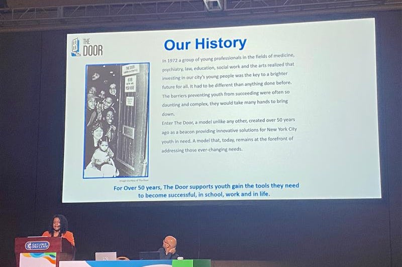 Tamara McDonald presenting on the history of The Door.
