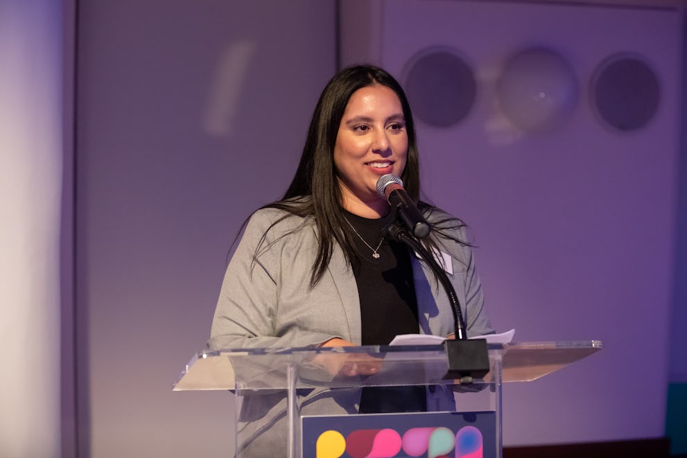 Meena Shah, Co-Managing Director of the Legal Services Center, The Door, delivering her speech