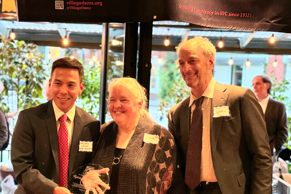 CEO Kelsey Louie receiving the Village Independent Democrats (VID) award on behalf of The Door at VID's annual gala, presented by VID Treasurer Irene Kaufman and VID President Jonathan Geballe.