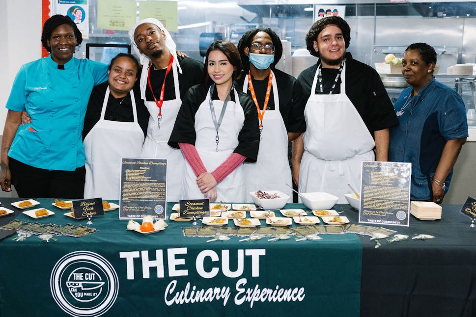 The Door's team of youth culinary interns with our chefs at Taste of Community 2024. The CUT is a unique 10-week paid culinary program that offers crew members real-world experience in our in-house kitchen while working to obtain ServSafe Food Handlers Certification.