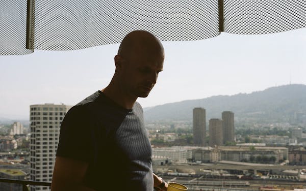 Man in front of window