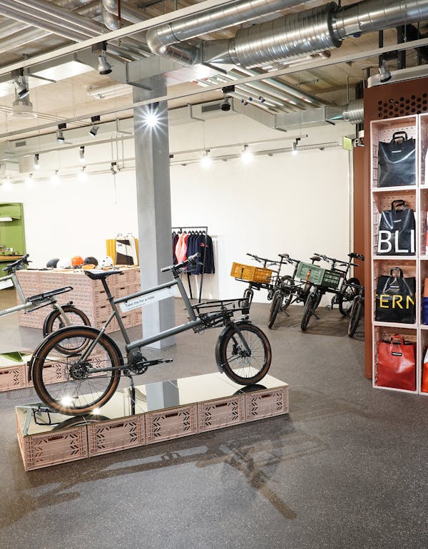 Inside view of MONoPOLE's Zurich store — displaying Toolbike No O1, Freitag bags and POC helmets