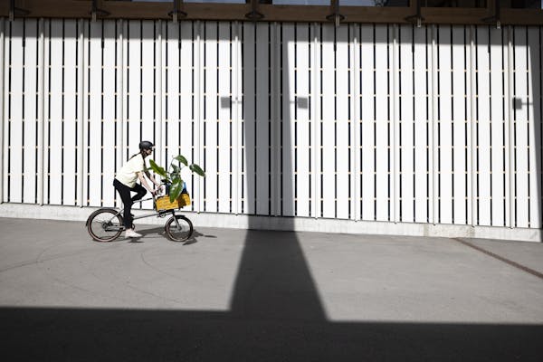 woman riding cargo bike