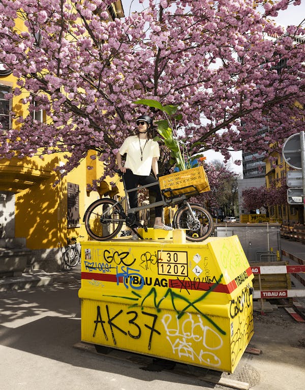 woman with cargo-bike on container
