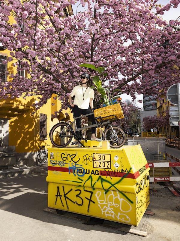 woman with cargo-bike on container