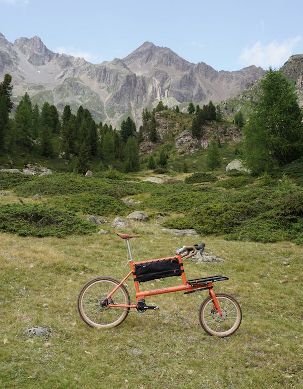 Sunset orange cargo bike in the mountains