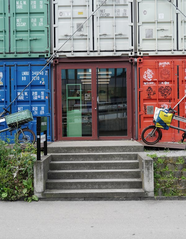 Two MONoPOLE cargo bikes in front of FREITAG Zurich flagship store