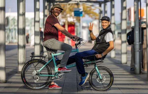 two guys on a cargo bike