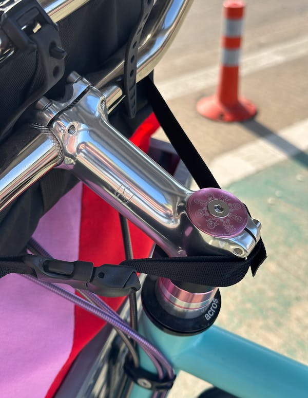 Close-up of the Probably Riding custom top cap.
