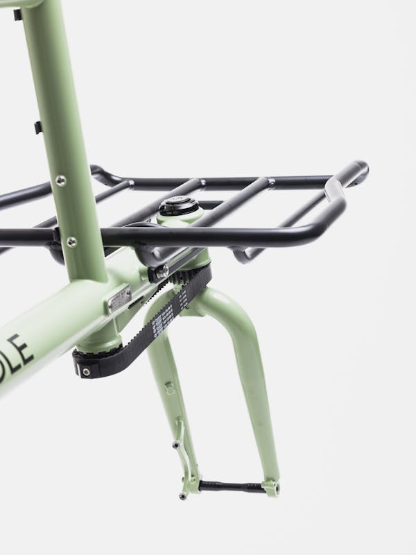 Detail shot from behind of a MONoPOLE cargo bike with cargo rack and proprietary belt steering