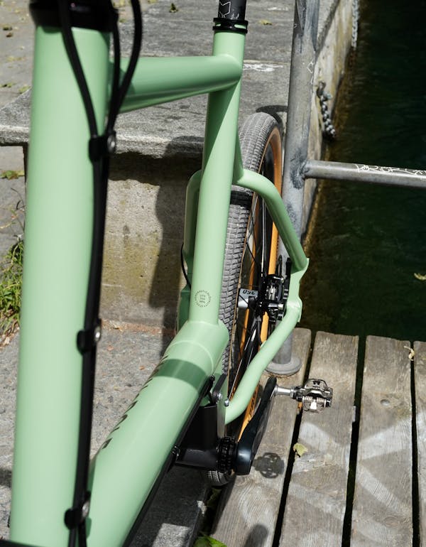 Close-up of a MONoPOLE custom pale green cargo bike's DT Swiss 350 Classic Rear Hub