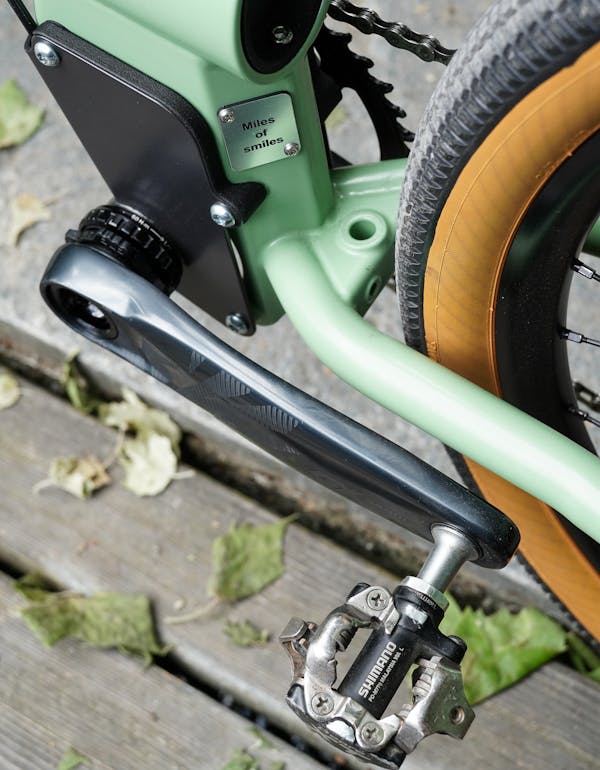 Close-up of MONoPOLE custom pale green cargo bike's Shimano clip pedal