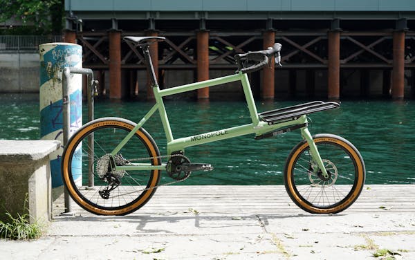 Custom pale green MONoPOLE cargo bike with drop bars and derailleur drivetrain