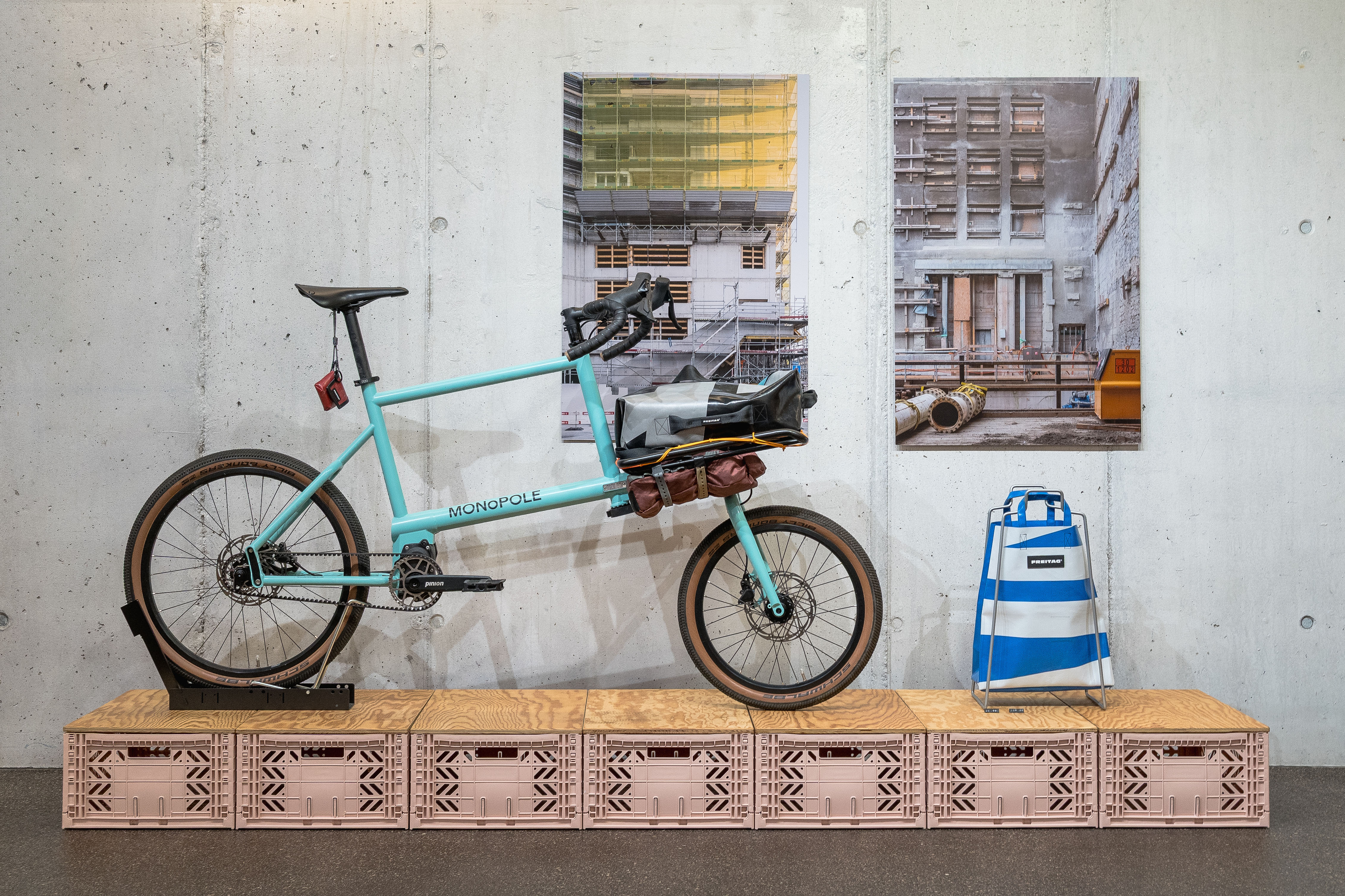 Custom blue MONoPOLE with Platform, Freitag Miami bag on display, and Federico Farinatti pictures in the wall behind.