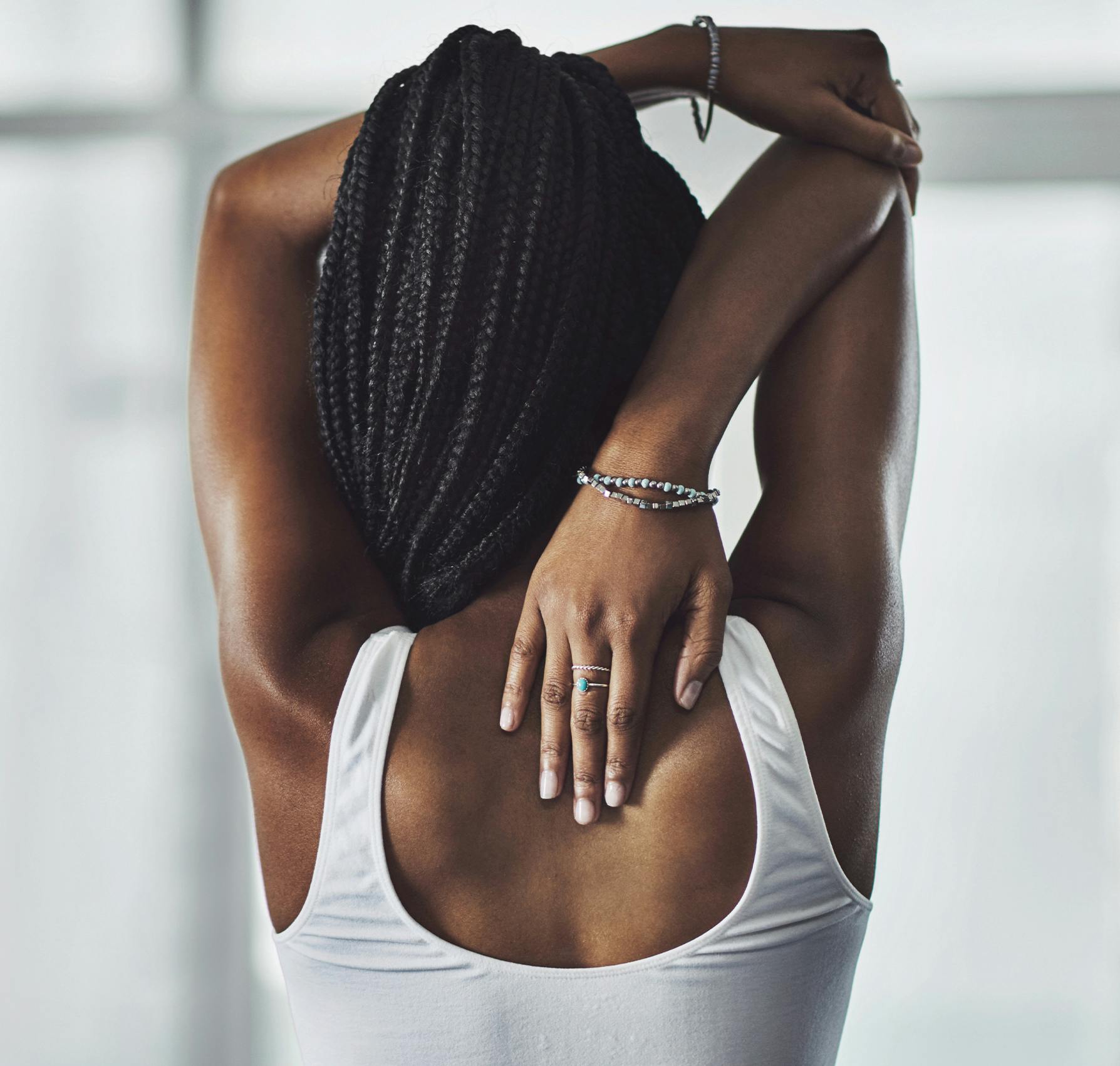 Woman touching her back