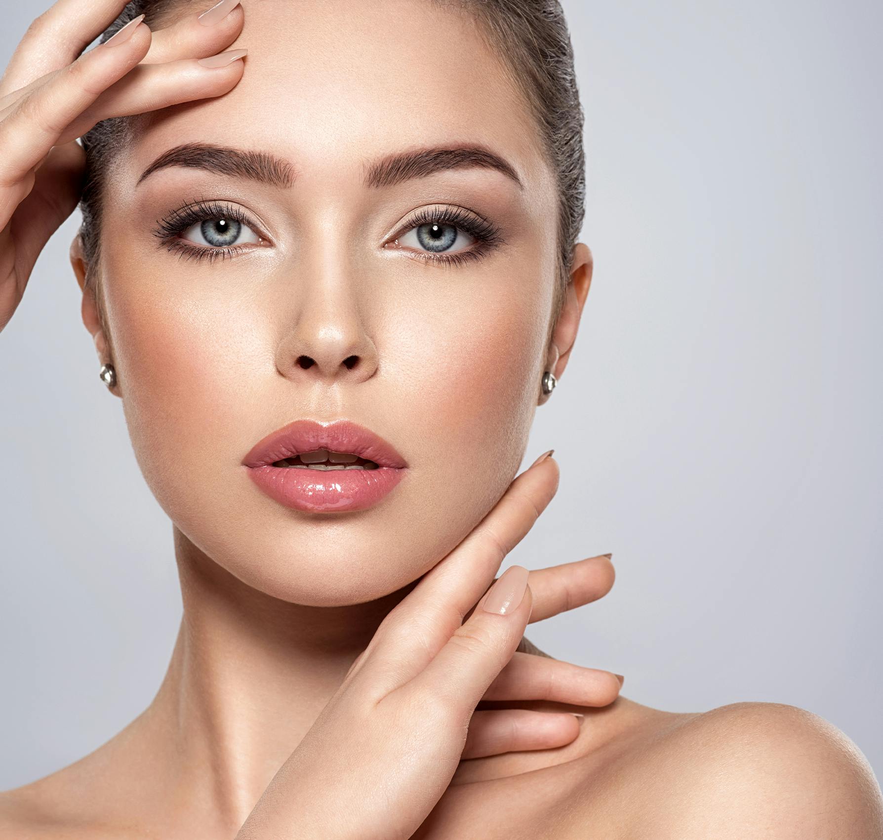 Woman touching her face