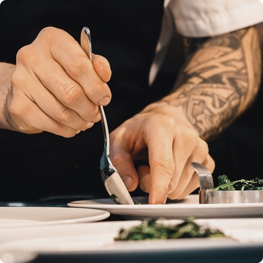 Chef serving a plate