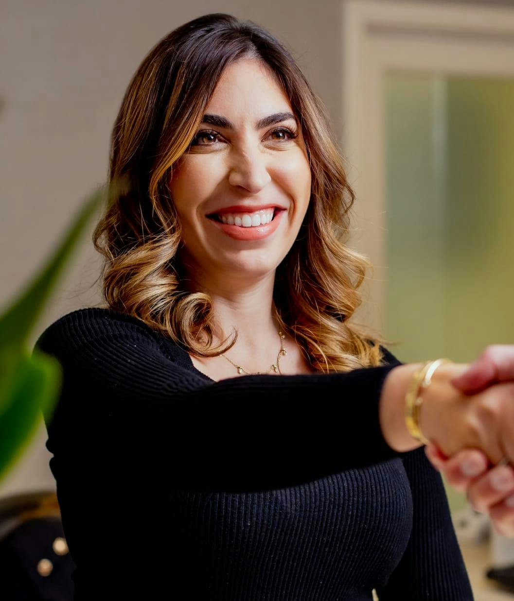 Woman smiling in Dr. Chow's office
