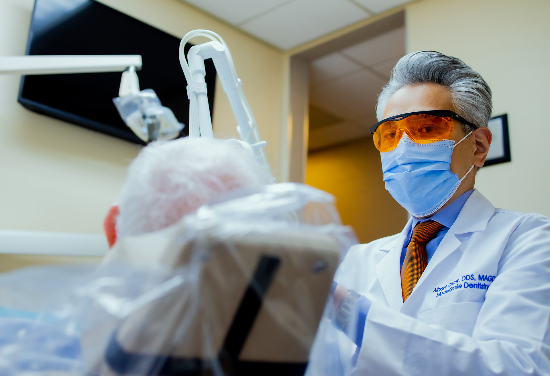 Dr. Chow attending a patient