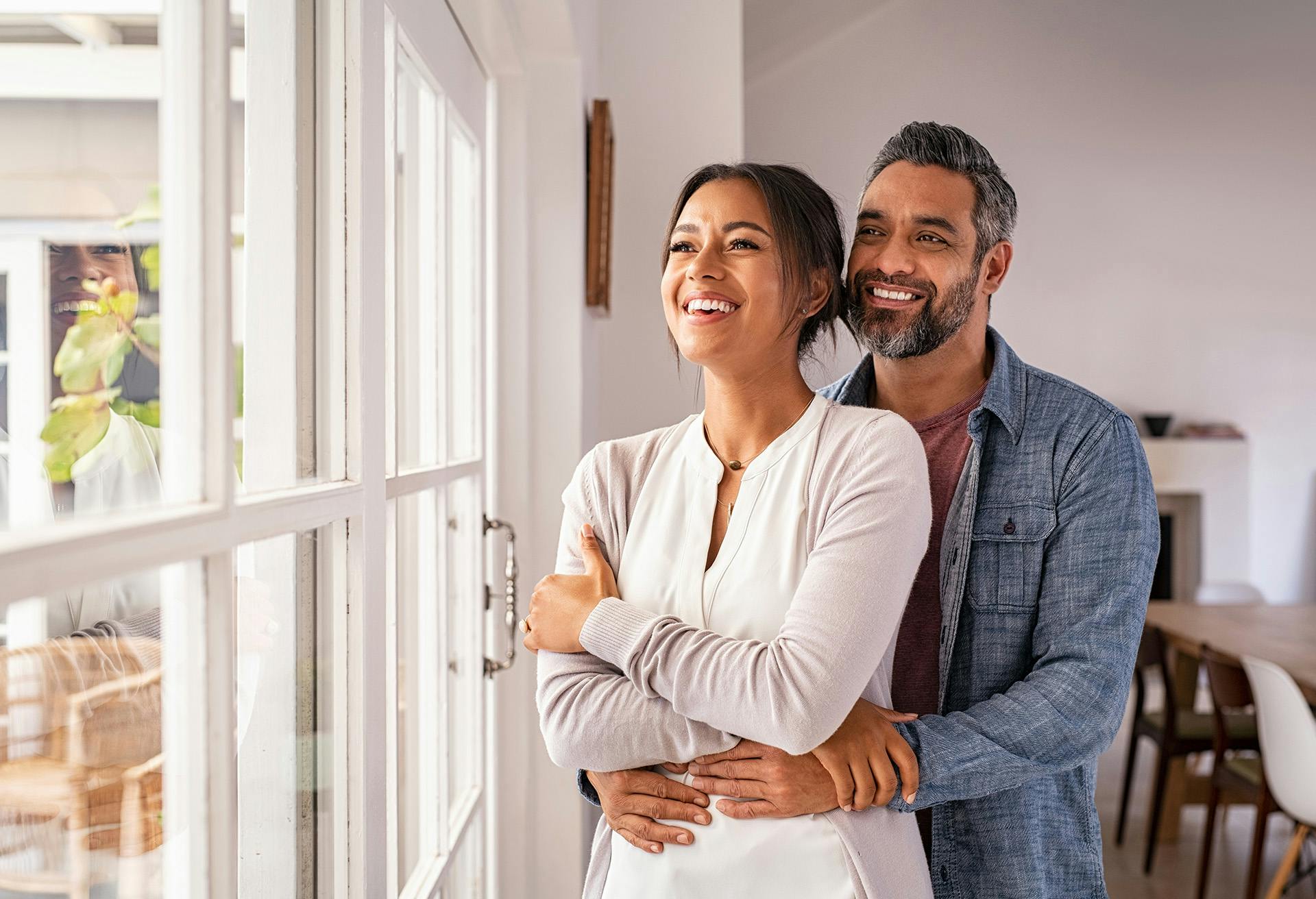 Couple Looking Out the Window