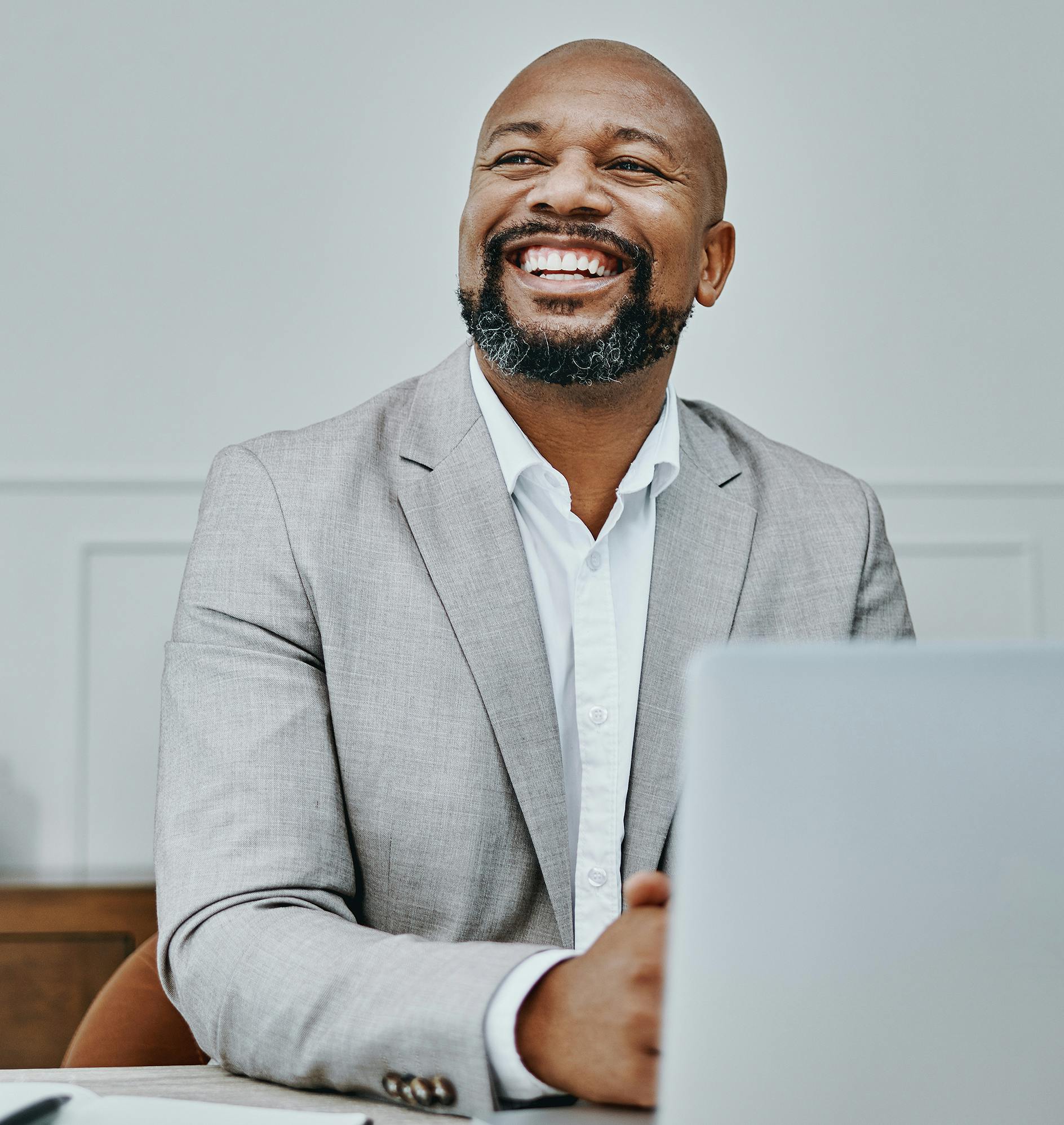 Smiling Man on His Laptop