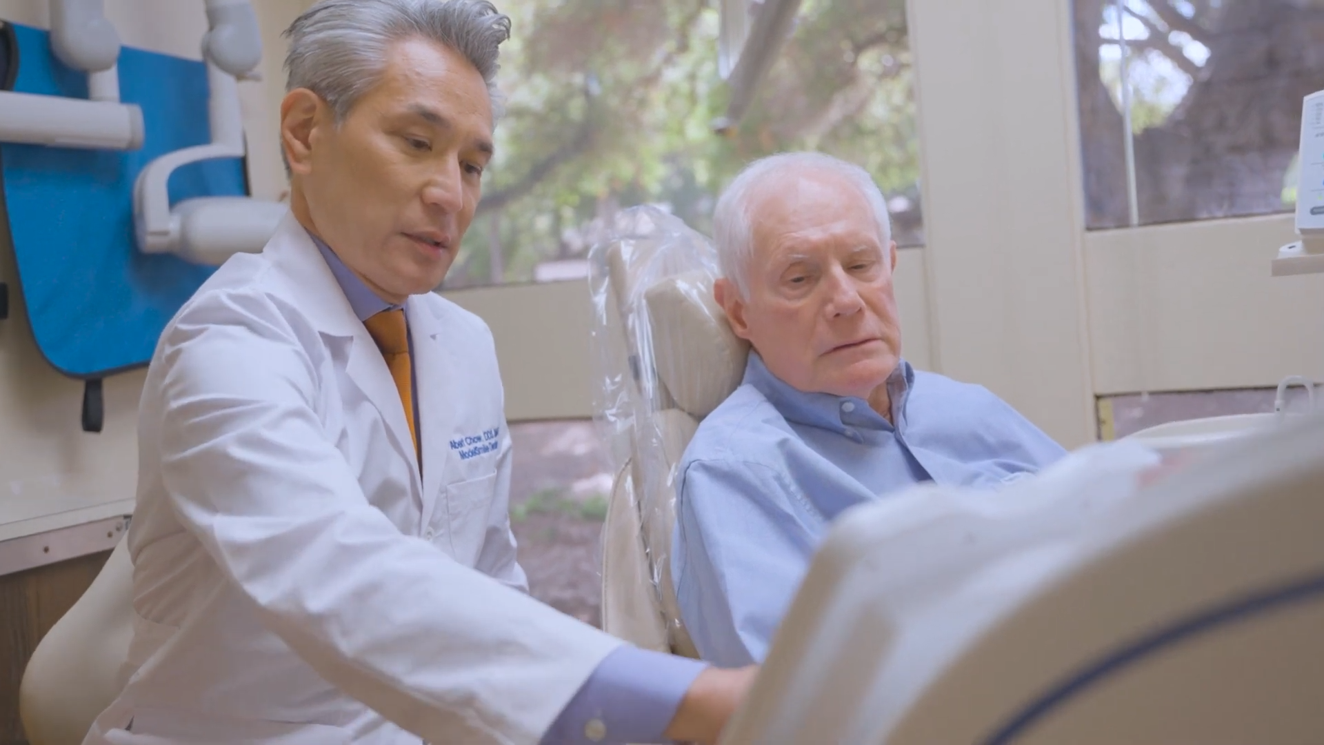 Dr. Chow with a Patient