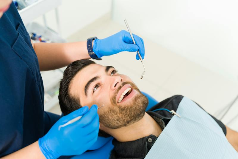 man getting his teeth cleaned